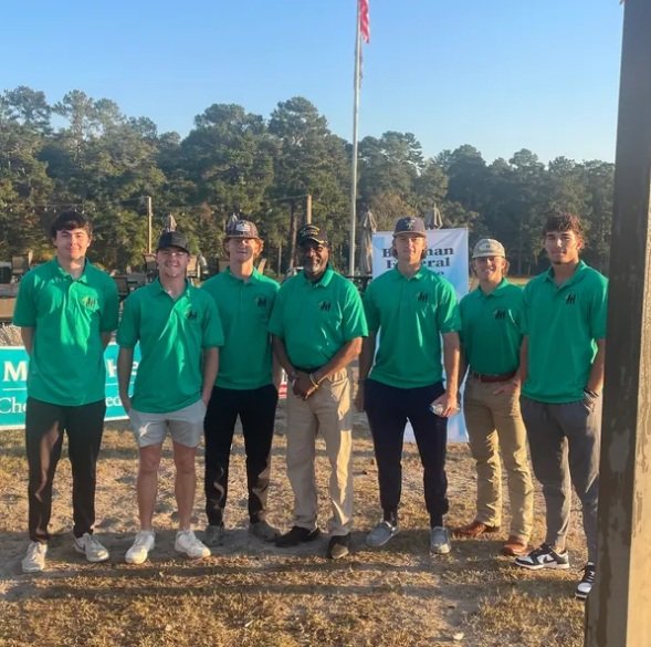 Golf tournament participants at the course